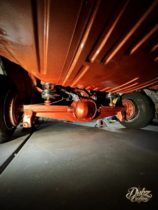 Orange-finished undercarriage with chrome suspension parts