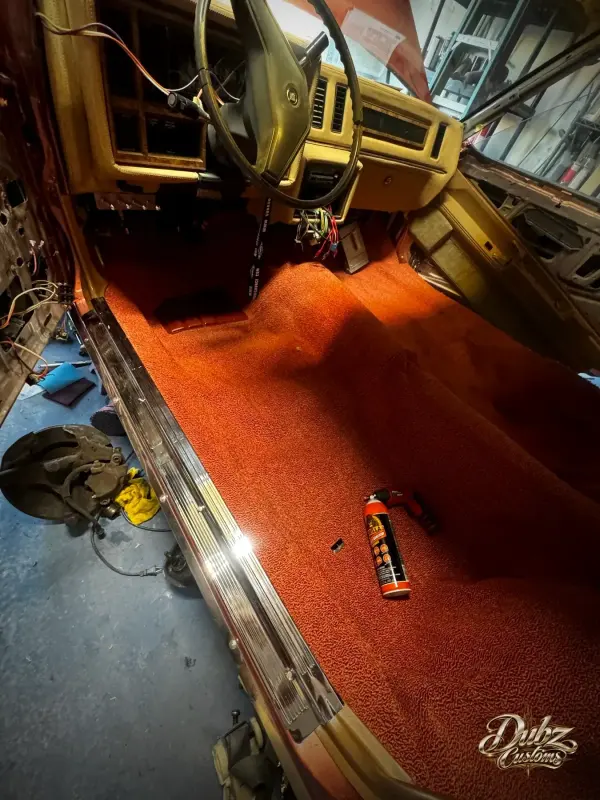 Orange interior floor with gold door panel