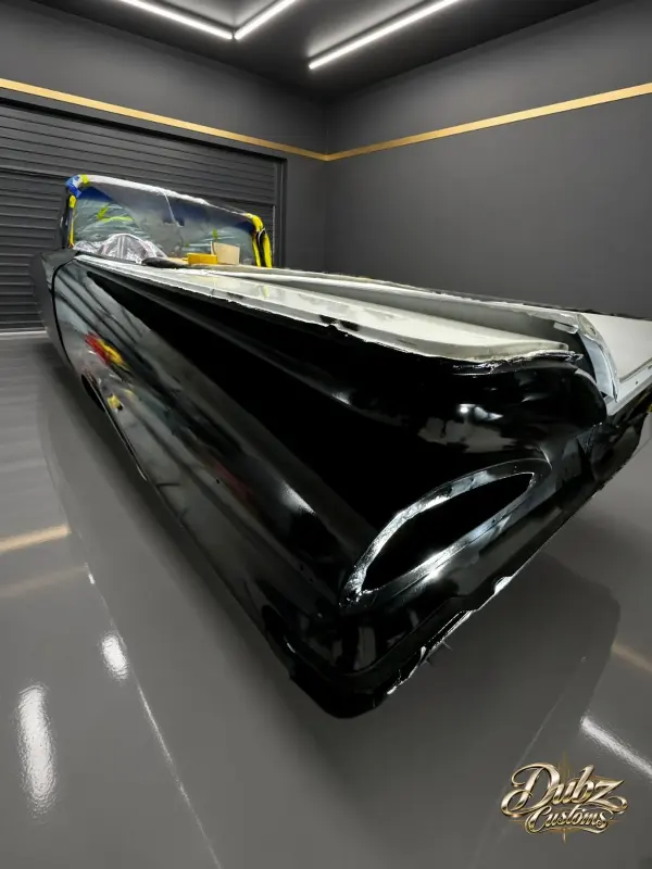 1959 Bel Air convertible finished in gloss black, front three-quarter view