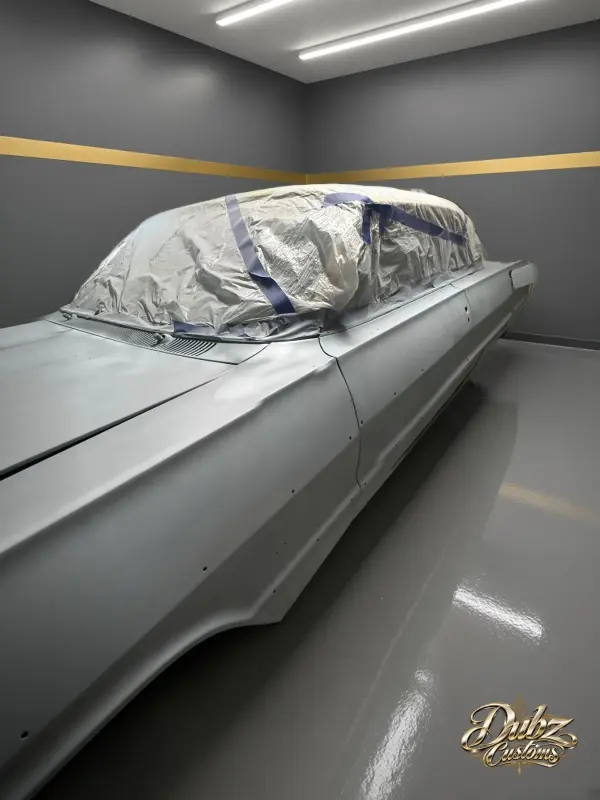 Chevrolet Impala in gray primer in the shop