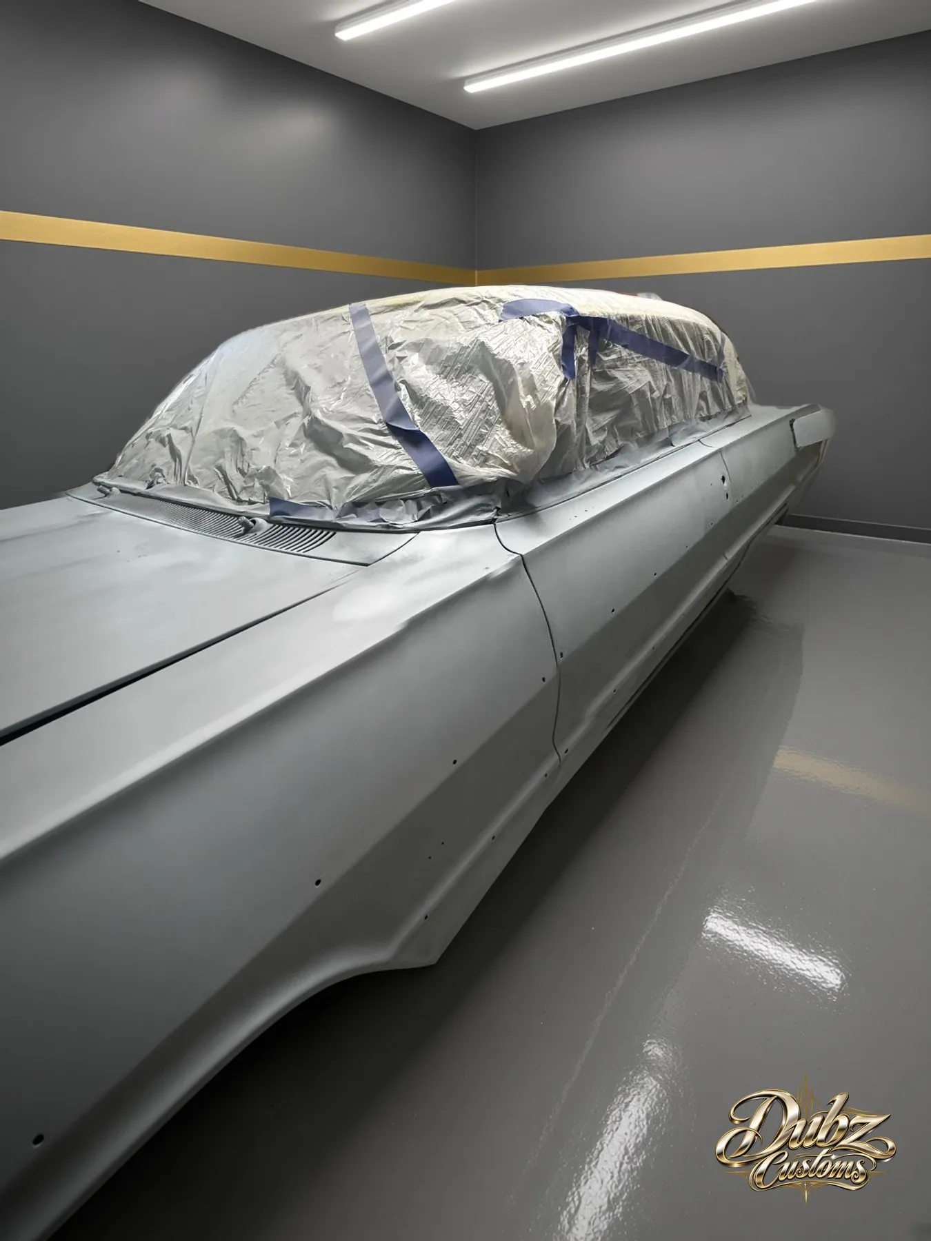 Chevrolet Impala in gray primer in the shop