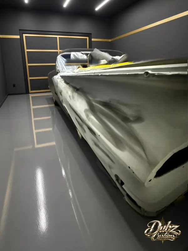 1959 Bel Air convertible in white primer during body prep