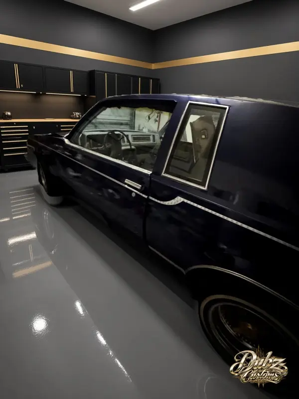 Blue car in the shop under lights