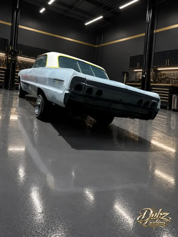 White Chevrolet Impala, rear three-quarter view